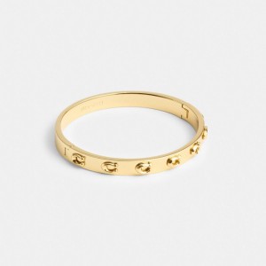 Women Coach Pegged Signature Hinged Bangle Bangles Gold | IN_CH82238